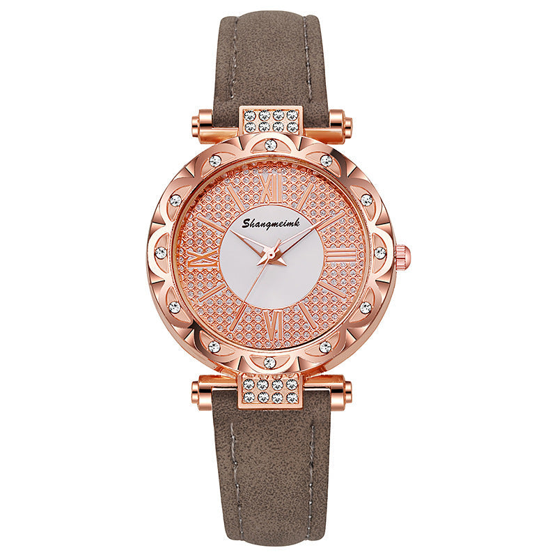 Korean-style quartz watch with a simple leather strap.